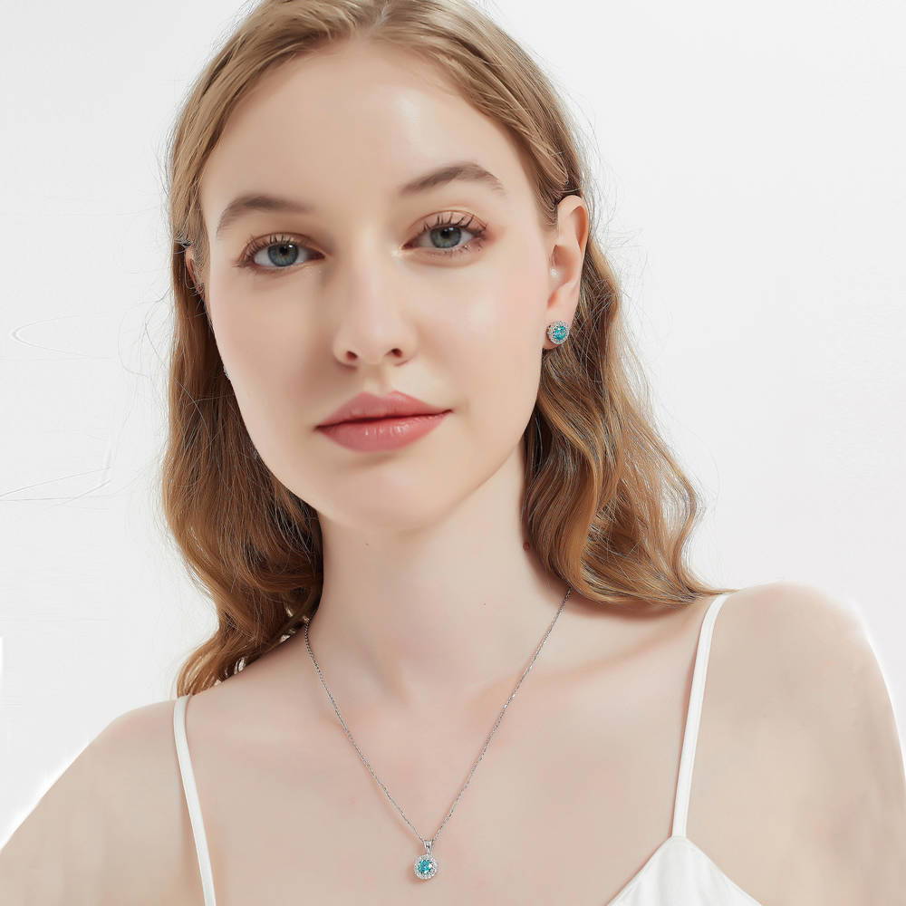 Model wearing Halo Kaleidoscope CZ Stud Earrings in Sterling Silver, Frosty Mint