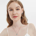 Model wearing Halo Kaleidoscope CZ Stud Earrings in Sterling Silver, Frosty Mint