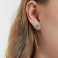 Model wearing Halo Kaleidoscope CZ Stud Earrings in Sterling Silver, Caramel