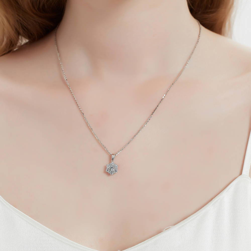 Model wearing Flower Halo CZ Necklace and Earrings in Sterling Silver, 11 of 17