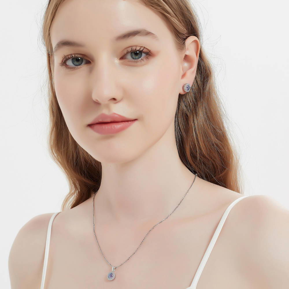 Model wearing Halo Kaleidoscope CZ Stud Earrings in Sterling Silver, Purple Aqua