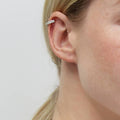 Model wearing CZ Ear Cuff Cartilage Earrings in Sterling Silver, Yellow Gold Flashed