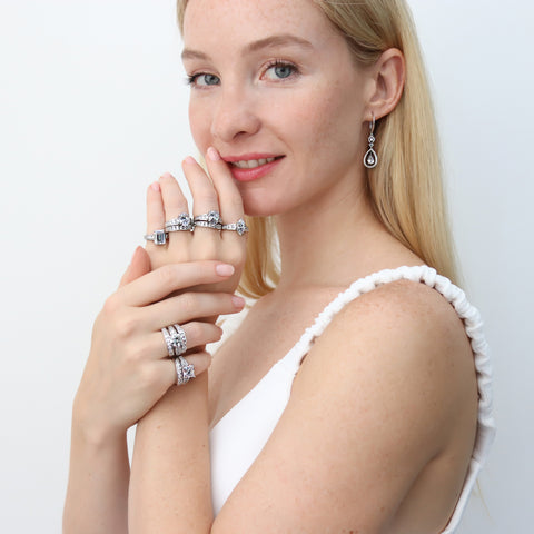 Model wearing statement rings wedding set in sterling silver and cubic zirconia