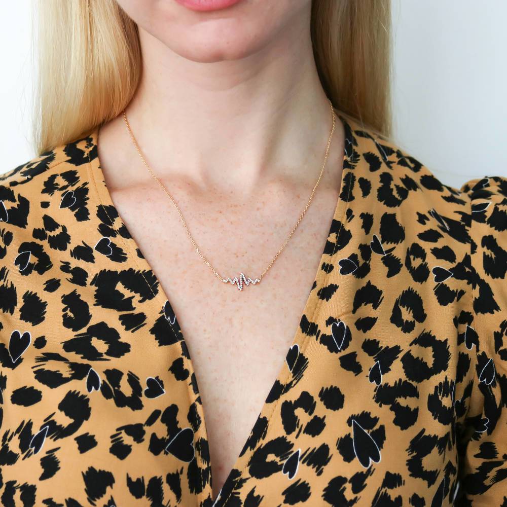 Model wearing Heartbeat CZ Necklace in Sterling Silver, Yellow Gold Flashed