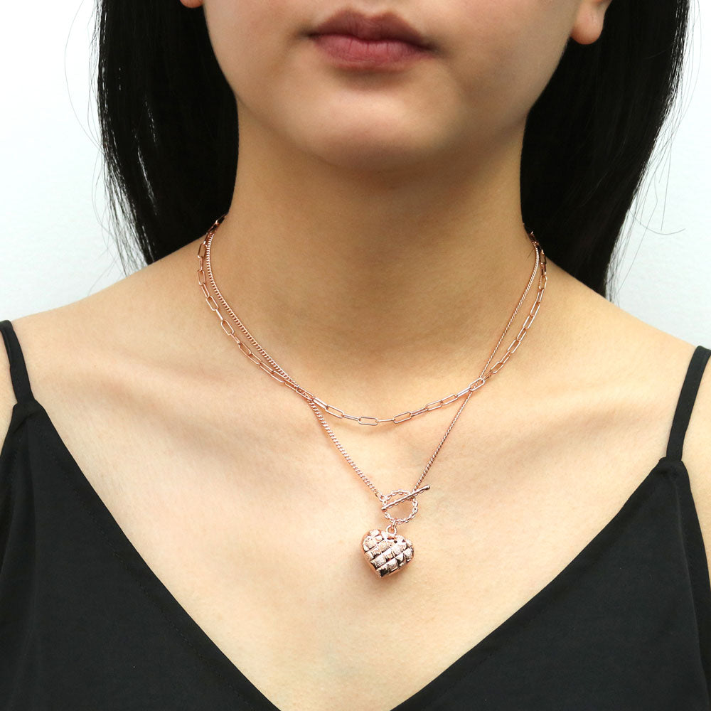 Model wearing Heart Checkerboard Toggle Pendant Necklace, Rose Gold Flashed