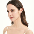 Model wearing Solitaire CZ Small Hoop Earrings Gold Flashed 0.6 inch, 0.6 inch, Gold-tone