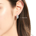 Model wearing Dome CZ Small Hoop Earrings in Sterling Silver, 0.62 inch