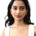 Model wearing Dome CZ Mini Cartilage Huggie Earrings in Sterling Silver 0.5 inch, Gold Flashed