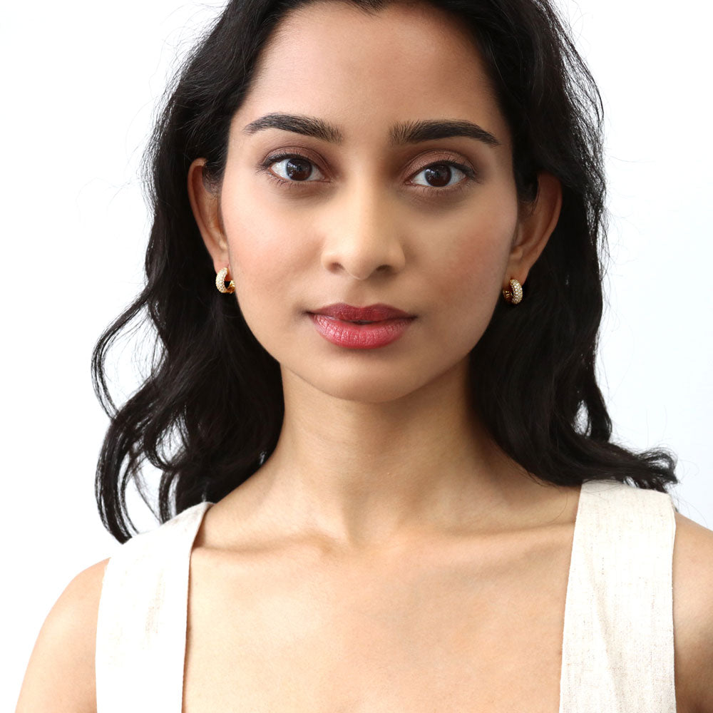 Model wearing Dome CZ Mini Cartilage Huggie Earrings in Sterling Silver 0.5 inch, Gold Flashed