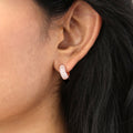 Model wearing Dome CZ Mini Cartilage Huggie Earrings in Sterling Silver 0.5 inch, Rose Gold Flashed