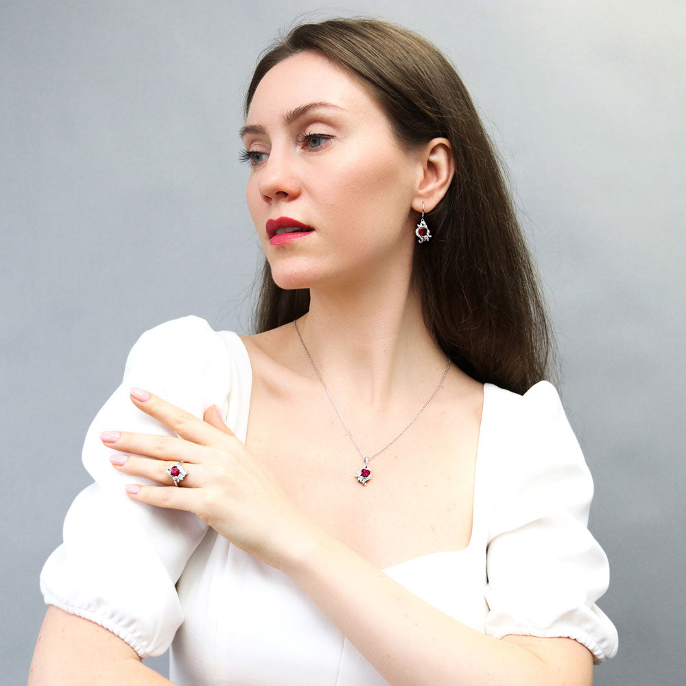 Model wearing Heart Flower Ruby-Red CZ Ring in Sterling Silver, 9 of 10