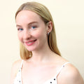 Model wearing Solitaire CZ Stud Earrings in Sterling Silver, 4mm