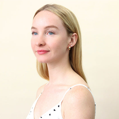 Model Wearing Dome Huggie Earrings, Solitaire Stud Earrings
