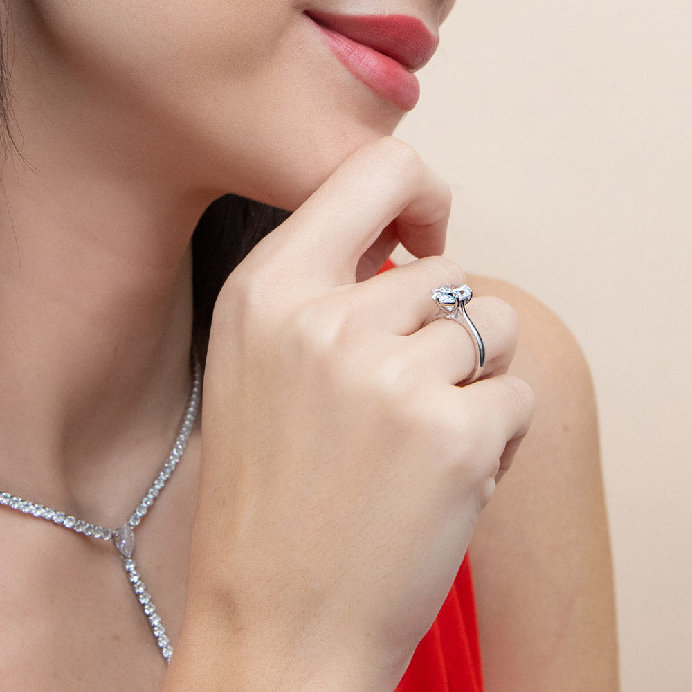 Model wearing Solitaire 3ct Oval CZ Ring in Sterling Silver, 7 of 17