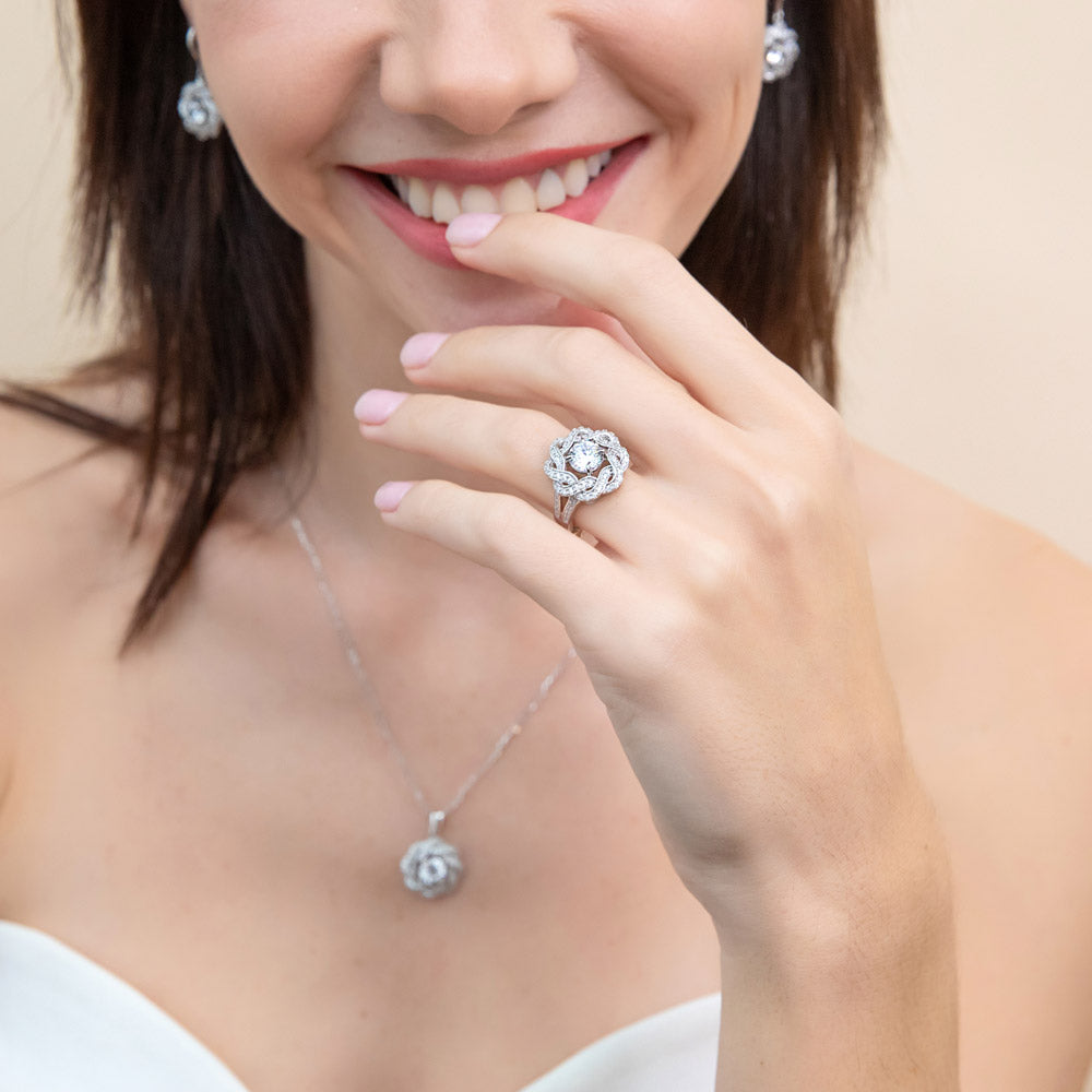 Model wearing Flower Woven Ribbon Wreath CZ Split Shank Ring in Sterling Silver, 2 of 12
