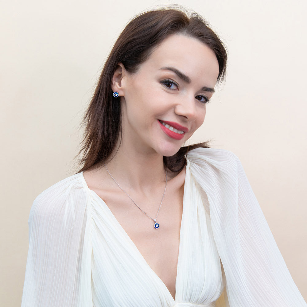 Model wearing Halo Art Deco Round CZ Pendant Necklace in Sterling Silver, 2 of 7