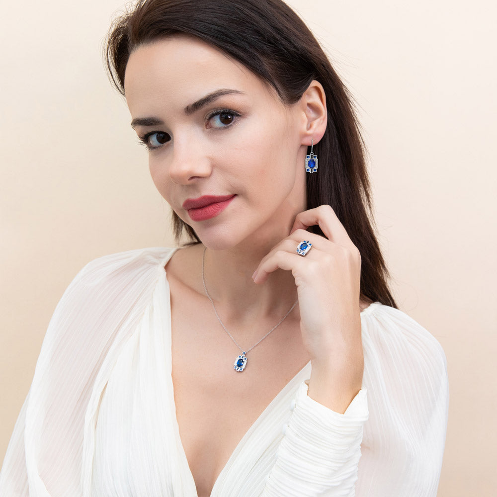 Model wearing Art Deco Simulated Blue Sapphire CZ Dangle Earrings in Sterling Silver, 2 of 4