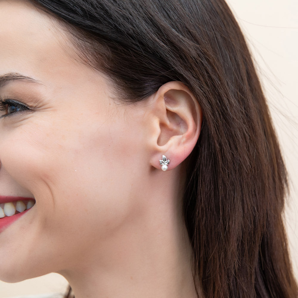 Model wearing Leaf Imitation Pearl Stud Earrings in Sterling Silver, 5 of 10