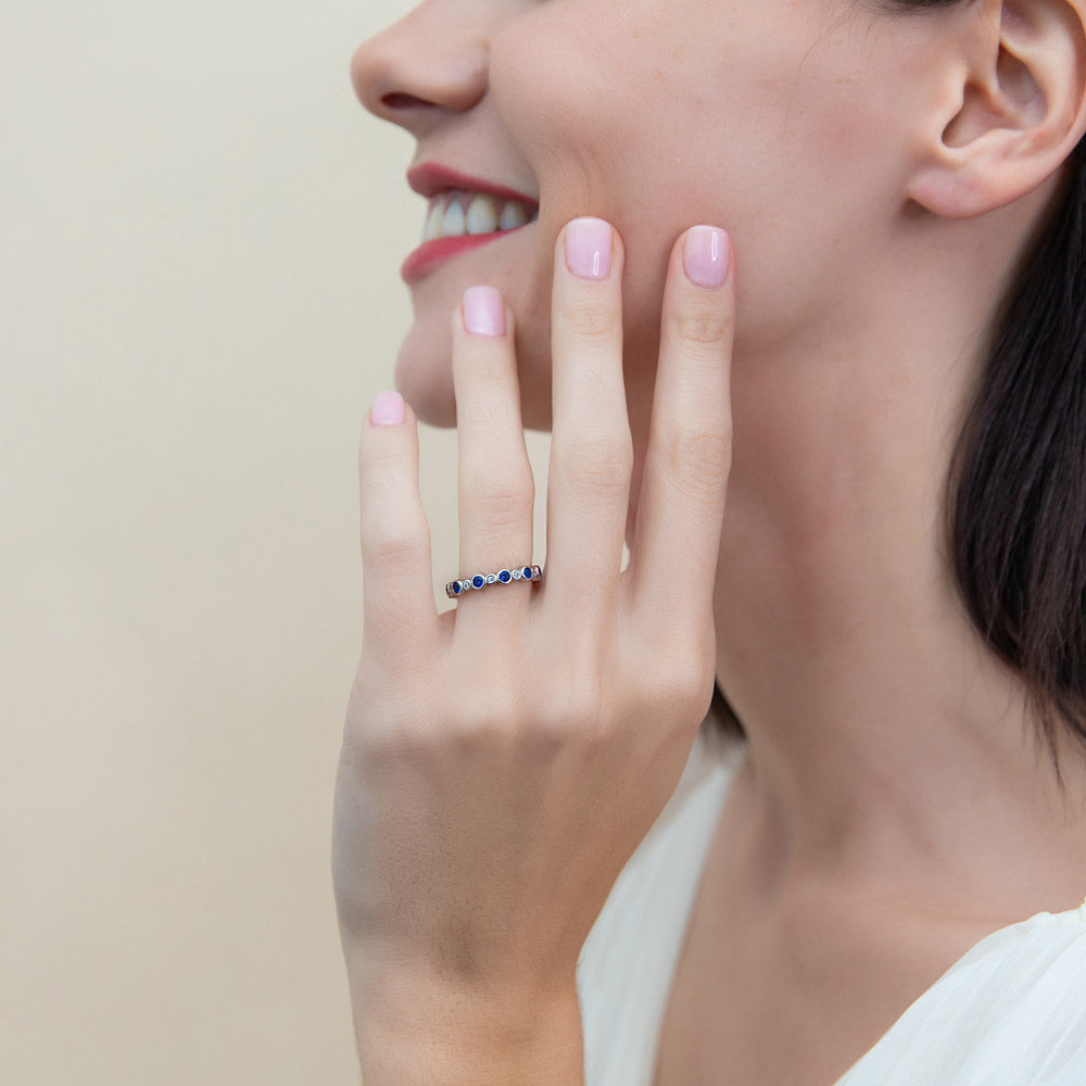 Model wearing Bubble Sapphire-Blue Bezel CZ Eternity Ring in Sterling Silver, 2 of 10