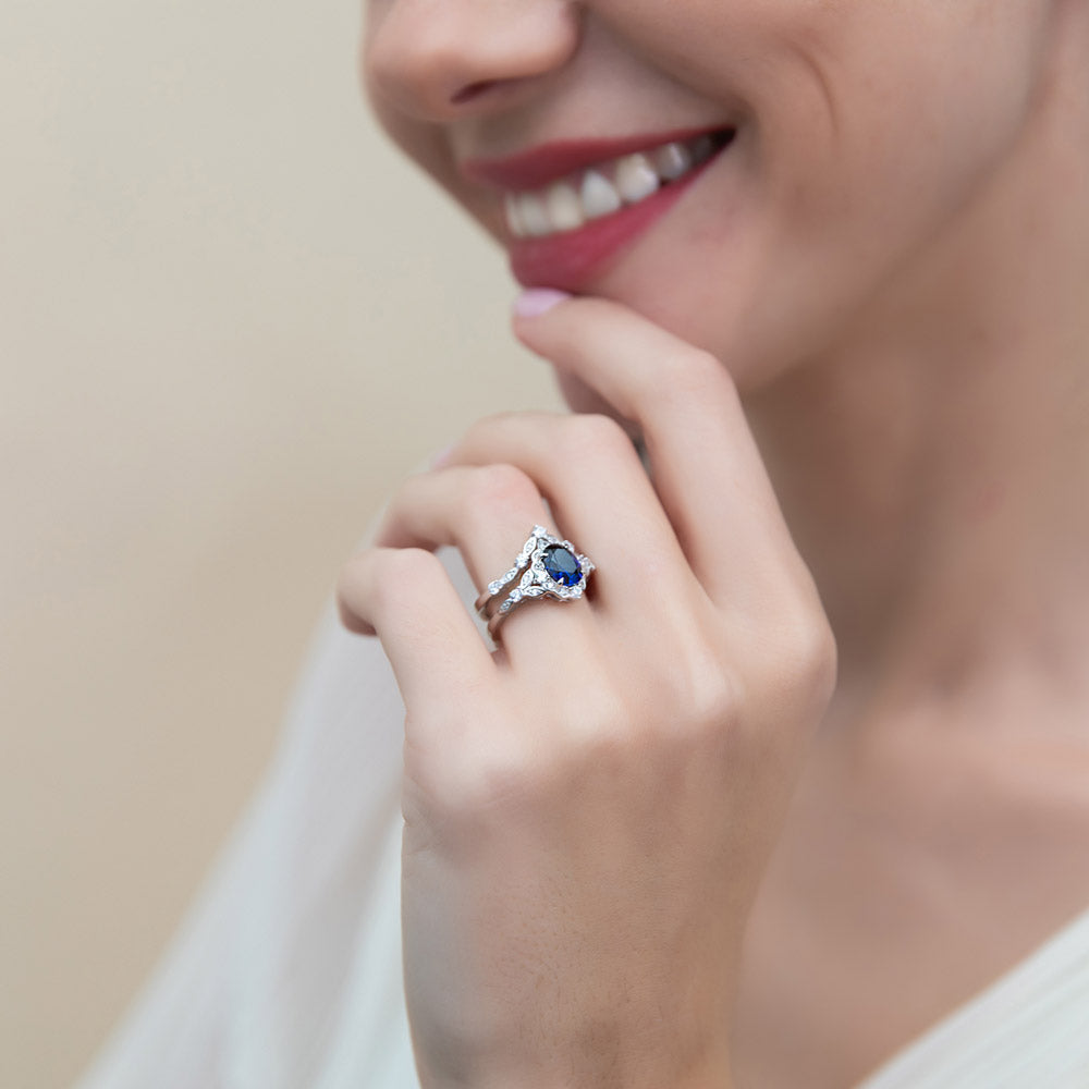 Model wearing Chevron Halo Simulated Blue Sapphire CZ Ring Set in Sterling Silver, 7 of 17