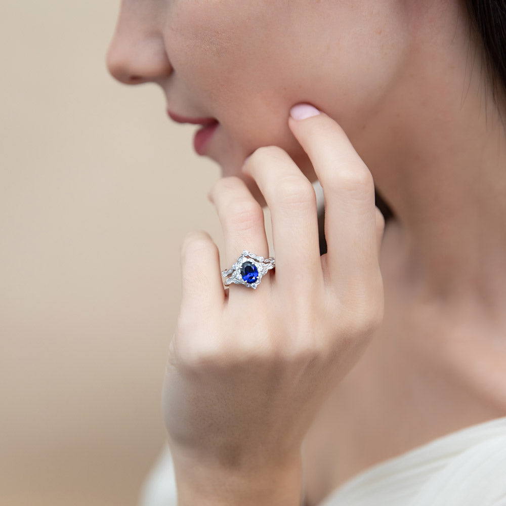 Model wearing Chevron Halo Simulated Blue Sapphire CZ Ring Set in Sterling Silver, 2 of 17