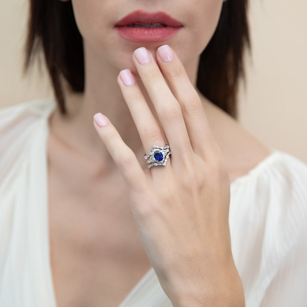 Model wearing Chevron Halo Simulated Blue Sapphire CZ Ring Set in Sterling Silver, 3 of 17