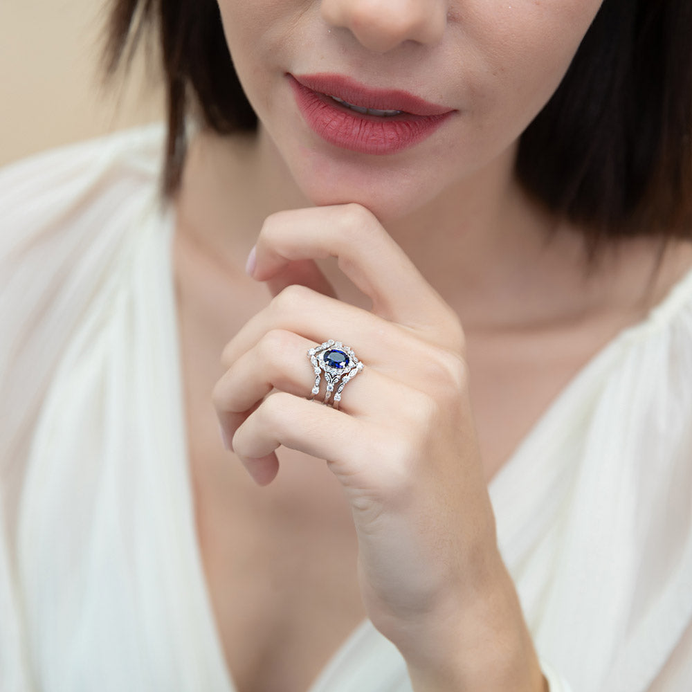 Model wearing Halo Simulated Blue Sapphire Oval CZ Ring Set in Sterling Silver, 9 of 18