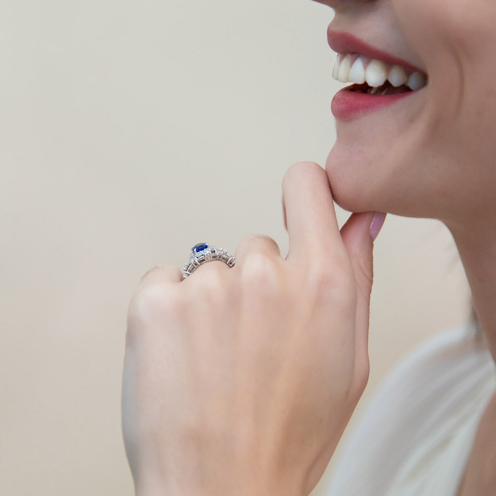 Model wearing Chevron Halo Simulated Blue Sapphire CZ Ring Set in Sterling Silver, 6 of 17