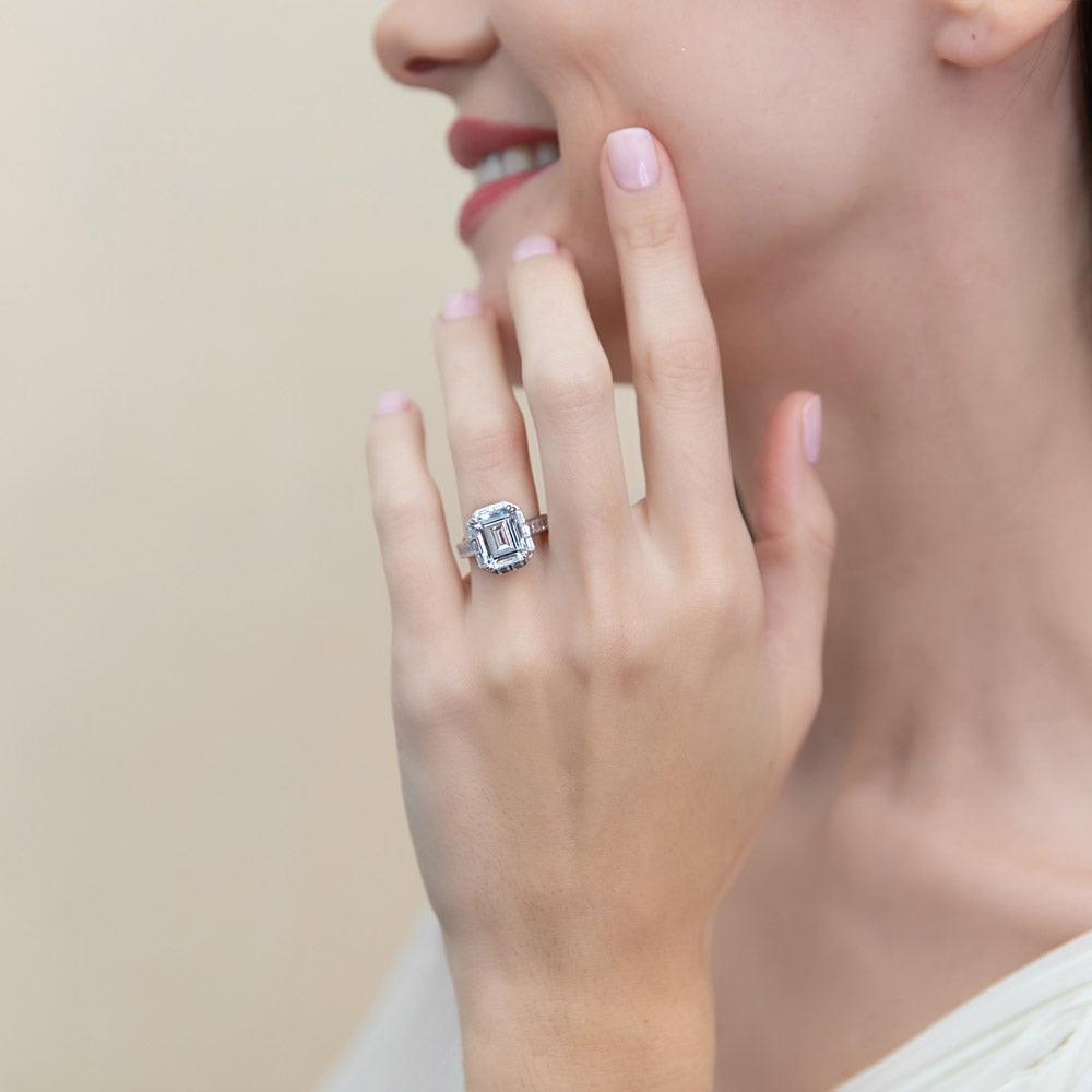 Model wearing Halo Art Deco Step Emerald Cut CZ Ring in Sterling Silver, 2 of 9
