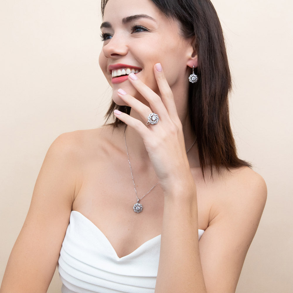 Model wearing Flower Ribbon CZ Necklace and Earrings Set in Sterling Silver, 3 of 12