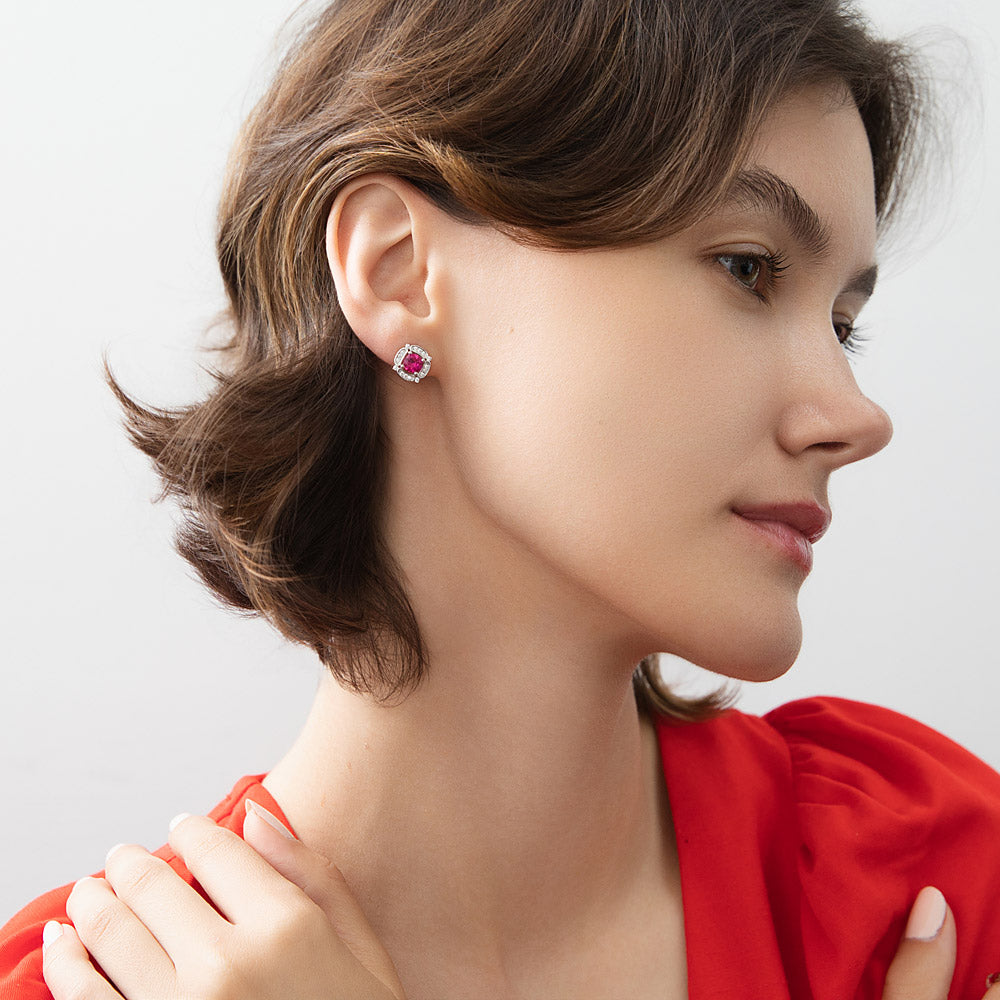 Model wearing Flower Halo CZ Stud Earrings in Sterling Silver, Emerald Color
