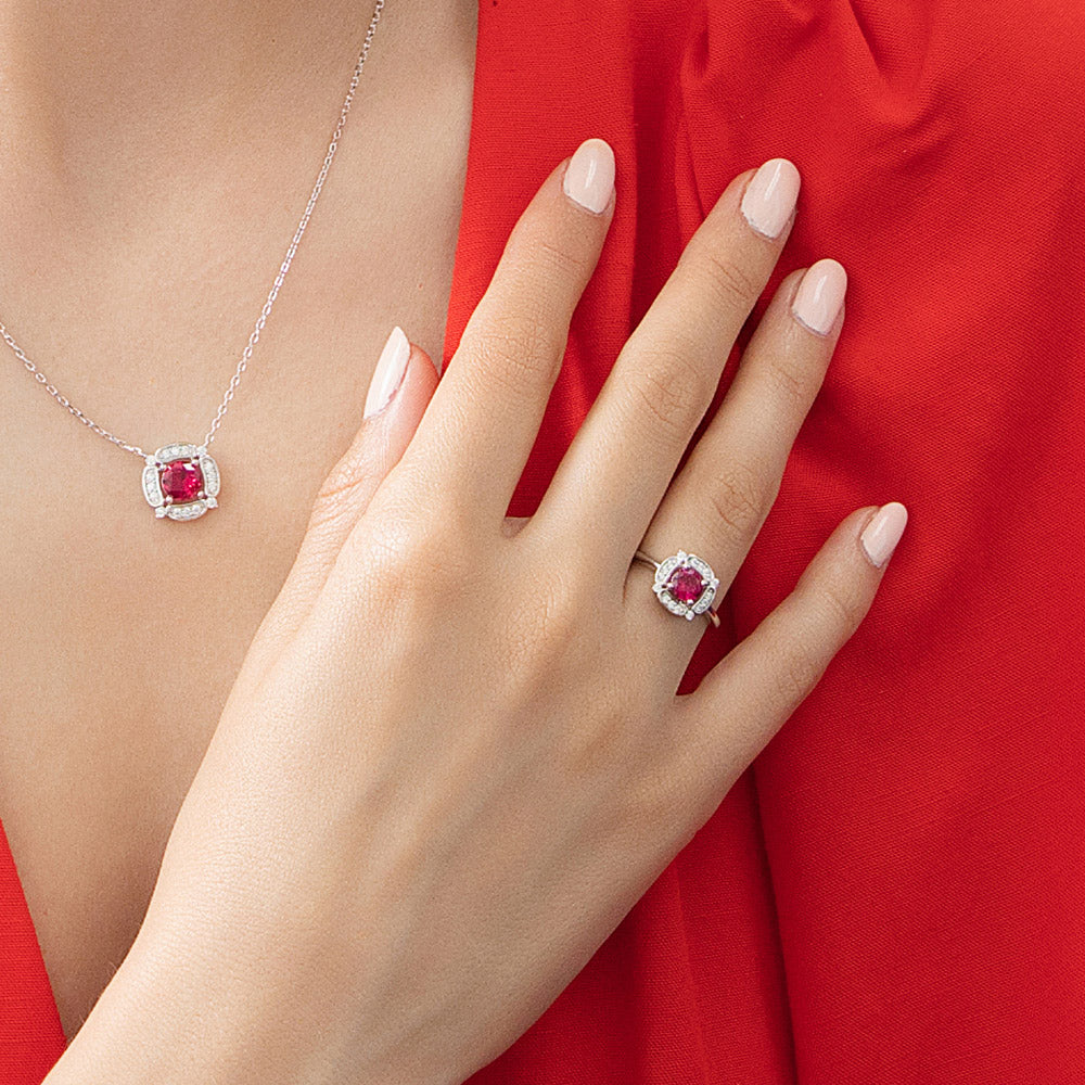 Model wearing Halo Flower Ruby-Red CZ Ring in Sterling Silver, 3 of 12