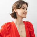 Model wearing Key and Lock CZ Stud Earrings in Sterling Silver, Red Color