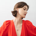 Model wearing Halo Clover Oval CZ Earrings in Sterling Silver, Red Color