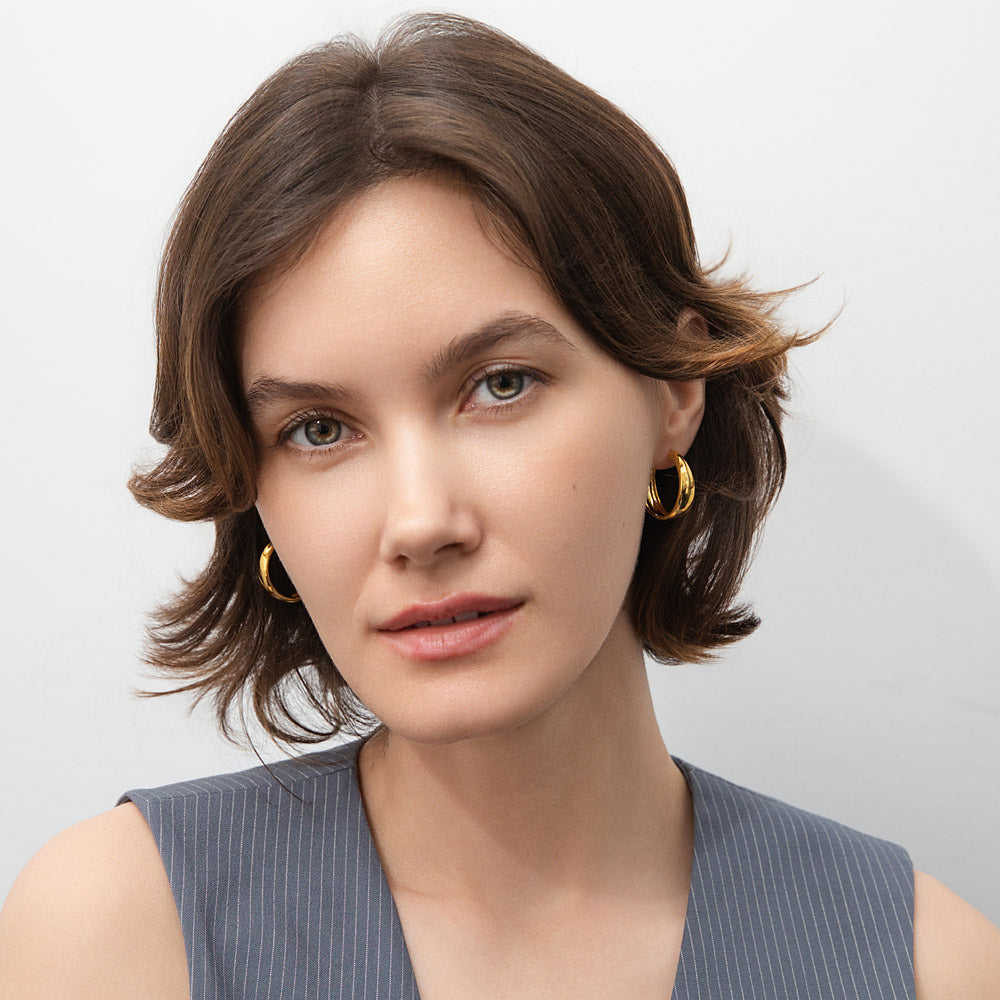 Model wearing Dome Small Hoop Earrings in Sterling Silver 0.8-1 inch, 2 Pairs, Yellow Gold Flashed