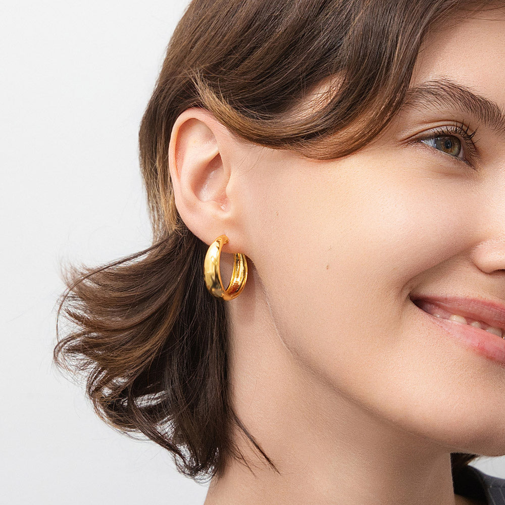 Model wearing Dome Small Hoop Earrings in Sterling Silver 0.8-1 inch, 2 Pairs, Yellow Gold Flashed