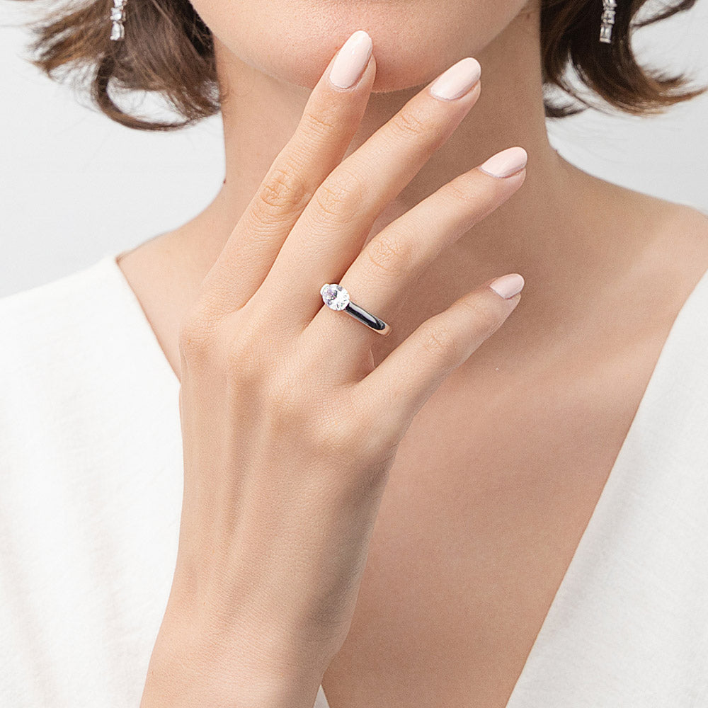 Model wearing Solitaire East-West 1.2ct Bezel Oval CZ Ring in Sterling Silver, 2 of 10