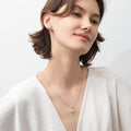 Model wearing North Star CZ Stud Earrings in Sterling Silver, Rhodium Plated