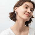 Model wearing Dome Small Hoop Earrings in Sterling Silver 0.8-1 inch, 2 Pairs, Rhodium Plated