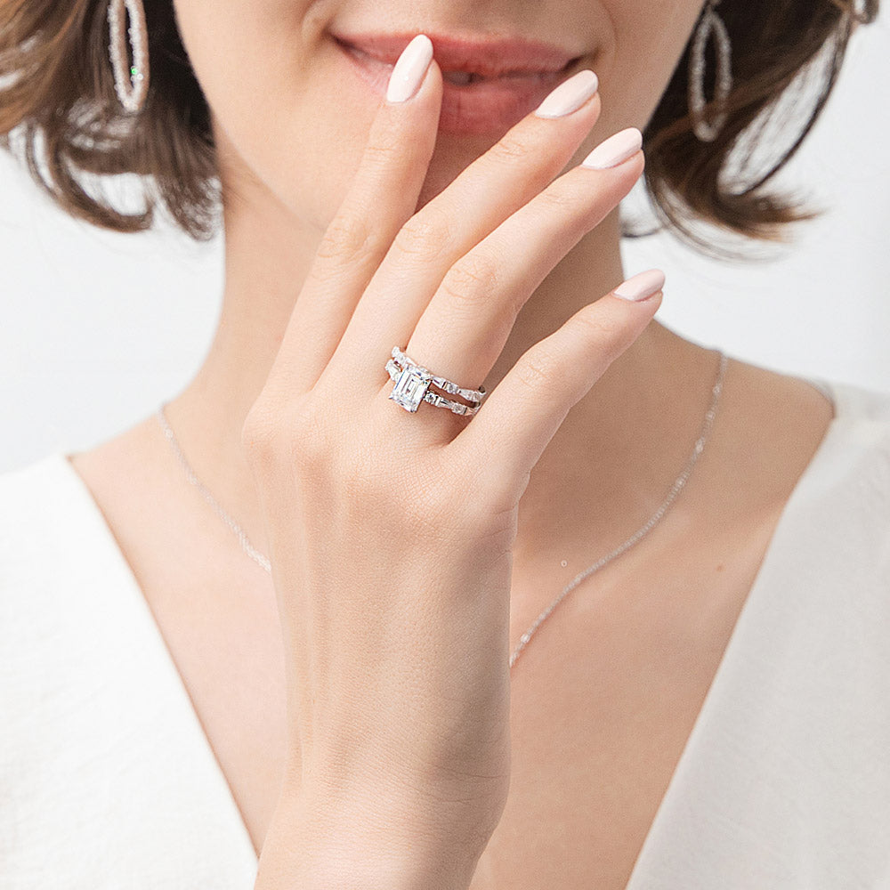 Model wearing Solitaire Art Deco Emerald Cut CZ Ring Set in Sterling Silver, 8 of 13