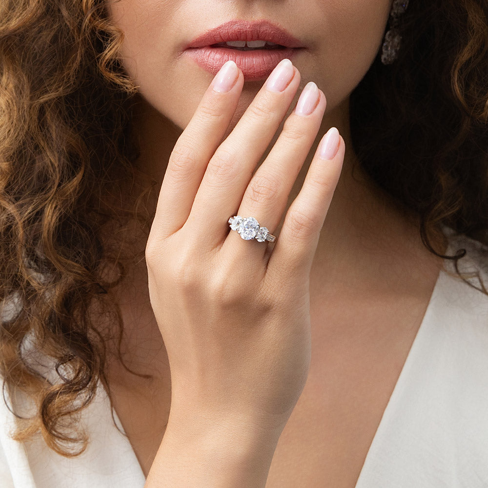 Model wearing 3-Stone 1.8ct Oval CZ Ring in Sterling Silver, 3 of 9