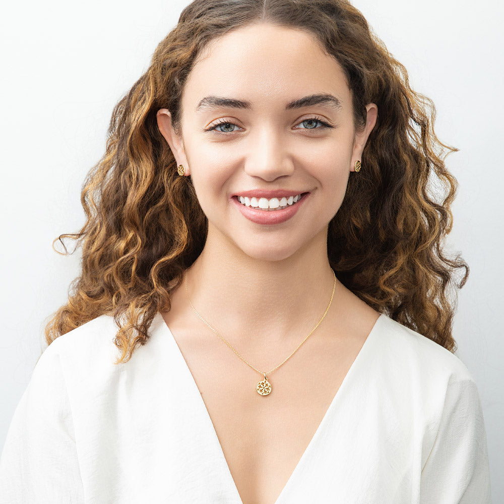 Model wearing Snowflake Coin Necklace in Sterling Silver, Yellow Gold Flashed