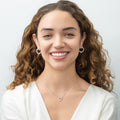 Model wearing Open Heart CZ Necklace in Sterling Silver, Yellow Gold Flashed