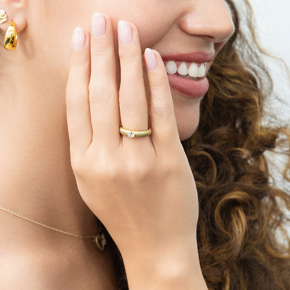 Model wearing Solitaire Bezel CZ Ring in Gold Flashed Sterling Silver, 6 of 9