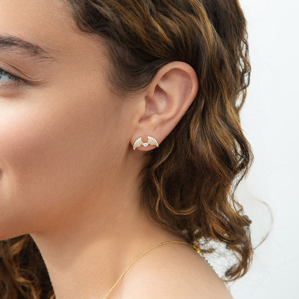 Model wearing Bat CZ Stud Earrings in Gold Flashed Sterling Silver, 2 of 8
