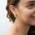 Model wearing Dome Small Hoop Earrings in Sterling Silver 0.8-1 inch, 2 Pairs, Yellow Gold Flashed