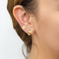 Model wearing Hummingbird Flower CZ Stud Earrings in Sterling Silver, Gold Flashed