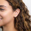 Model wearing North Star CZ Stud Earrings in Sterling Silver, Yellow Gold Flashed