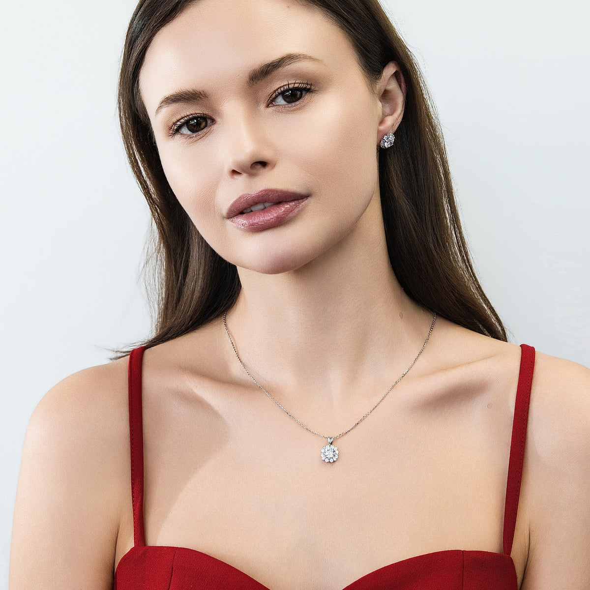 Model wearing Halo Flower CZ Stud Earrings in Sterling Silver, 5 of 6