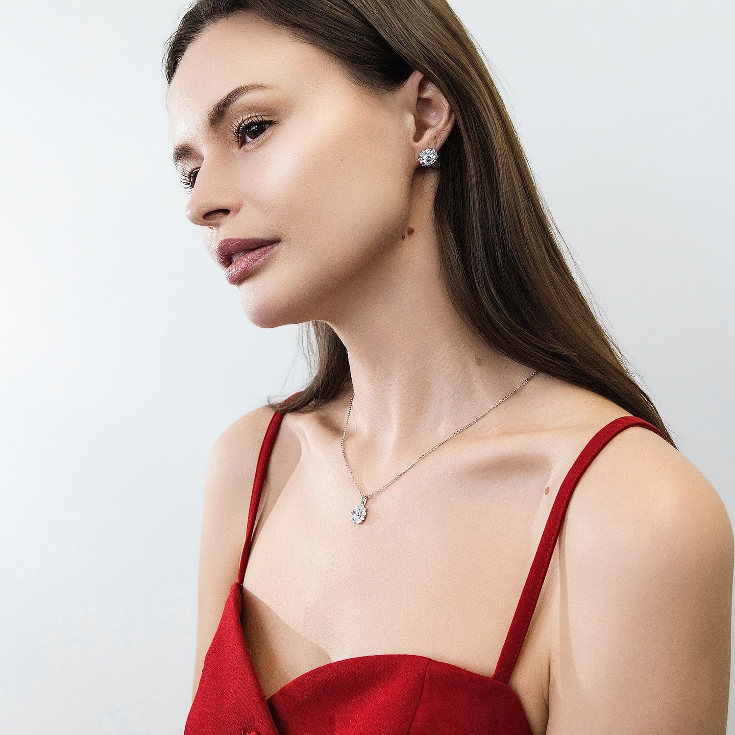 Model wearing Halo Flower CZ Stud Earrings in Sterling Silver, 4 of 6